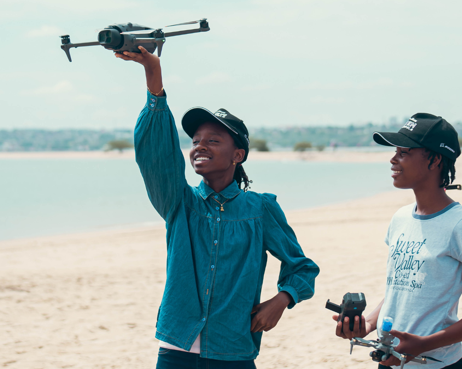 Students operating a drone during the ThinkYoung STEM School in Angola