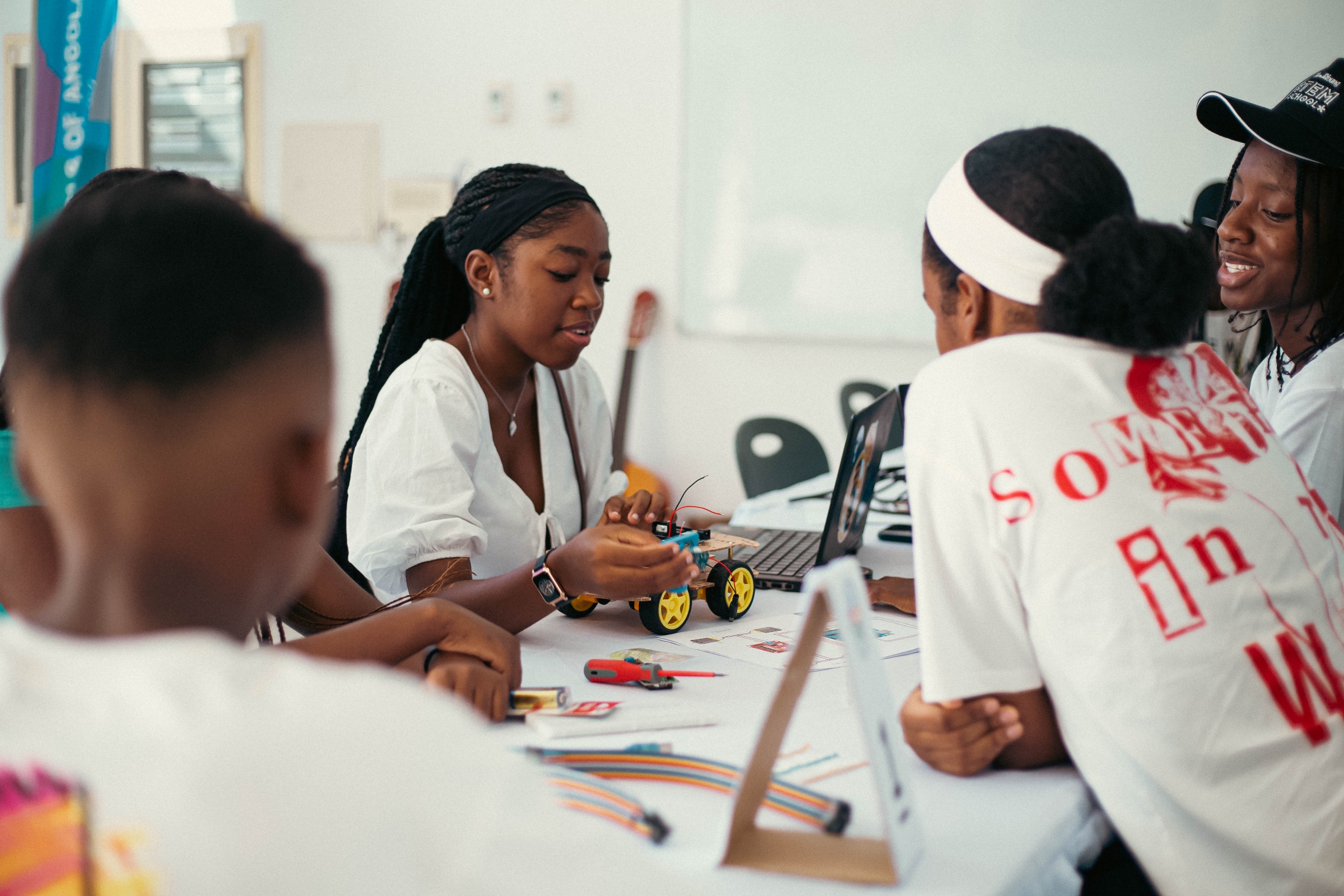 Students workshop ping their robotics project during the ThinkYoung STEM School in Angola